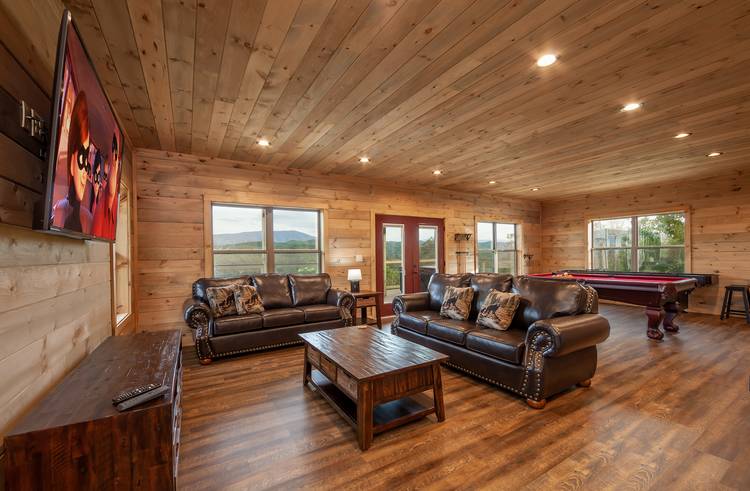 smoky mountain cabin game room with couches