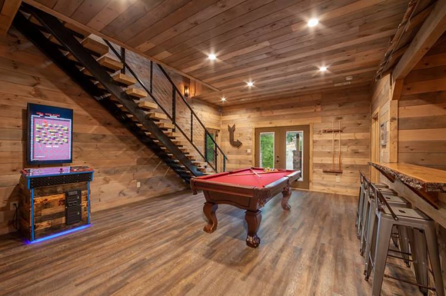 game room with pool table and bar